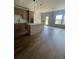 Bright kitchen and eating area with wood floors and stainless steel appliances at 129 Silvercrest Dr, Acworth, GA 30101