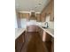 Bright kitchen featuring stainless steel appliances, light wood cabinets, and quartz countertops at 129 Silvercrest Dr, Acworth, GA 30101