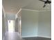 Bright living room featuring neutral gray walls, white trim, and wood-look tile flooring at 129 Silvercrest Dr, Acworth, GA 30101