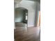 Bright living room featuring dark hardwood floors, neutral gray walls, and an outdoor view at 129 Silvercrest Dr, Acworth, GA 30101