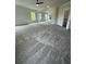 Expansive living room showcasing gray carpeting, recessed lights, and views to other rooms at 129 Silvercrest Dr, Acworth, GA 30101