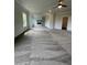 Spacious living room featuring plush gray carpet, recessed lighting, and an open layout at 129 Silvercrest Dr, Acworth, GA 30101