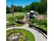 Gathering-friendly playground with modern play structures and lush greenery, perfect for outdoor recreation at 129 Silvercrest Dr, Acworth, GA 30101