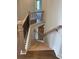 Elegant staircase features wood steps, black iron spindles, and light wood railing at 129 Silvercrest Dr, Acworth, GA 30101