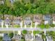Aerial view showcases neighborhood layout, homes with manicured lawns at 2084 Democracy Dr, Buford, GA 30519