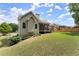 Back exterior with fenced yard, patio and screened-in porch at 2084 Democracy Dr, Buford, GA 30519
