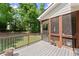 Back porch featuring a dog door and fenced yard at 2084 Democracy Dr, Buford, GA 30519