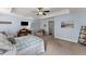Spacious bedroom featuring a tray ceiling, ceiling fan, and light blue walls at 2084 Democracy Dr, Buford, GA 30519