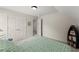 Neutral bedroom features double door closet and blue decorative boat shelf at 2084 Democracy Dr, Buford, GA 30519