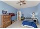 Cozy blue bedroom with a bed, dresser, and themed decor at 2084 Democracy Dr, Buford, GA 30519