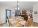 Comfortable dining area with wood floors and view into the kitchen at 2084 Democracy Dr, Buford, GA 30519