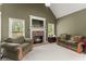 Inviting living room showcasing a cozy fireplace, plush seating and natural light for a comfortable ambiance at 2084 Democracy Dr, Buford, GA 30519