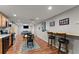 Finished basement living area with stainless appliances, bar seating, and a billiard table at 2084 Democracy Dr, Buford, GA 30519