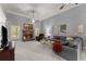 Spacious living room featuring stone fireplace, ceiling fan, and comfortable seating for a relaxing atmosphere at 2084 Democracy Dr, Buford, GA 30519