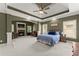 Spacious main bedroom with fireplace, tray ceiling, and sitting area at 2084 Democracy Dr, Buford, GA 30519