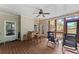Covered porch with table and chairs, ceiling fan, screened windows and lighting at 2084 Democracy Dr, Buford, GA 30519