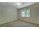 Bedroom featuring a ceiling fan, natural light, and carpet flooring at 3957 Woodland Cir, Conyers, GA 30013