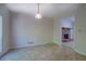 Eat-in kitchen space with vinyl floors, light fixture, and access to the living room at 3957 Woodland Cir, Conyers, GA 30013