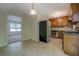 Kitchen with wood cabinets, stainless steel appliances, and vinyl floors at 3957 Woodland Cir, Conyers, GA 30013