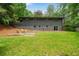 Expansive backyard view featuring a well-maintained lawn, patio, and lush greenery at 4206 Lake Laurel Se Dr, Smyrna, GA 30082