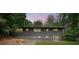 Charming backyard featuring a patio, green lawn, and stairs leading to an upper deck at 4206 Lake Laurel Se Dr, Smyrna, GA 30082