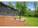 Exterior view of a house with a beautiful backyard, green grass, and a patio at 4206 Lake Laurel Se Dr, Smyrna, GA 30082