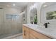 Modern bathroom with glass enclosed shower, and double vanity at 4206 Lake Laurel Se Dr, Smyrna, GA 30082