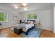 Bright bedroom with hardwood floors, a large window, and area rug at 4206 Lake Laurel Se Dr, Smyrna, GA 30082
