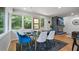 Elegant dining room with a modern table, hardwood floors, and fireplace views at 4206 Lake Laurel Se Dr, Smyrna, GA 30082