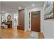 Welcoming entryway with a wooden front door, piano, and coat rack at 4206 Lake Laurel Se Dr, Smyrna, GA 30082