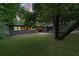 Beautiful home exterior with a well-maintained lawn and mature trees in a natural setting at 4206 Lake Laurel Se Dr, Smyrna, GA 30082