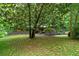 Lovely home with mature trees providing shade and beautifully landscaped front yard at 4206 Lake Laurel Se Dr, Smyrna, GA 30082