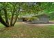 Home with beautifully landscaped front yard, mature trees, modern details at 4206 Lake Laurel Se Dr, Smyrna, GA 30082