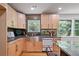 Kitchen features stainless steel appliances, black countertops, sink, and custom backsplash at 4206 Lake Laurel Se Dr, Smyrna, GA 30082