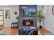 Cozy living room features brick fireplace, hardwood floors, and lots of natural light at 4206 Lake Laurel Se Dr, Smyrna, GA 30082