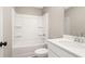 Clean bathroom featuring a white tub and shower combo plus a sink with neutral color at 4671 Larkfield Way, Powder Springs, GA 30127