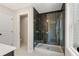 Modern bathroom featuring a glass-enclosed shower with dark herringbone tile and ample natural light at 4671 Larkfield Way, Powder Springs, GA 30127