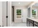 Bathroom with white marble floors, shower with stylish tiles, and vanity with sink at 4671 Larkfield Way, Powder Springs, GA 30127
