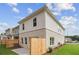 Beautiful exterior view of a modern home with a fenced backyard and small patio at 4671 Larkfield Way, Powder Springs, GA 30127