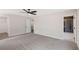 Large primary bedroom with ceiling fan and access to the bathroom with tile shower at 4671 Larkfield Way, Powder Springs, GA 30127