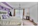 This bedroom features a comfortable bed, sliding glass door, a decorative chandelier, and stylish decor at 2638 Vinings Central Se Dr # 4, Atlanta, GA 30339