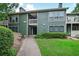 Green multi-Gathering home exterior with lawn, walkway, and multiple entryways at 2638 Vinings Central Se Dr # 4, Atlanta, GA 30339