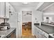 Kitchen features white cabinets and appliances with a view into the dining area at 2638 Vinings Central Se Dr # 4, Atlanta, GA 30339