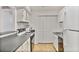 Bright kitchen features white cabinets and appliances at 2638 Vinings Central Se Dr # 4, Atlanta, GA 30339
