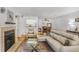 Open concept living room with fireplace, dining area, and view of the kitchen at 2638 Vinings Central Se Dr # 4, Atlanta, GA 30339