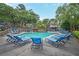 Enjoy the beautiful community pool with plentiful lounge chairs and inviting cool water on a sunny day at 2638 Vinings Central Se Dr # 4, Atlanta, GA 30339