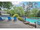 Enjoy the beautiful community pool with plentiful lounge chairs and inviting cool water on a sunny day at 2638 Vinings Central Se Dr # 4, Atlanta, GA 30339