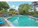 Relax and unwind at the community pool, complete with lounge chairs, a stone waterfall, and lush landscaping at 2638 Vinings Central Se Dr # 4, Atlanta, GA 30339
