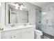 Bathroom with double sink vanity, shower, and toilet at 3880 Lake Lanier Dr, Duluth, GA 30097