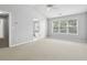 This bedroom includes an ensuite bathroom and lots of natural light at 3880 Lake Lanier Dr, Duluth, GA 30097